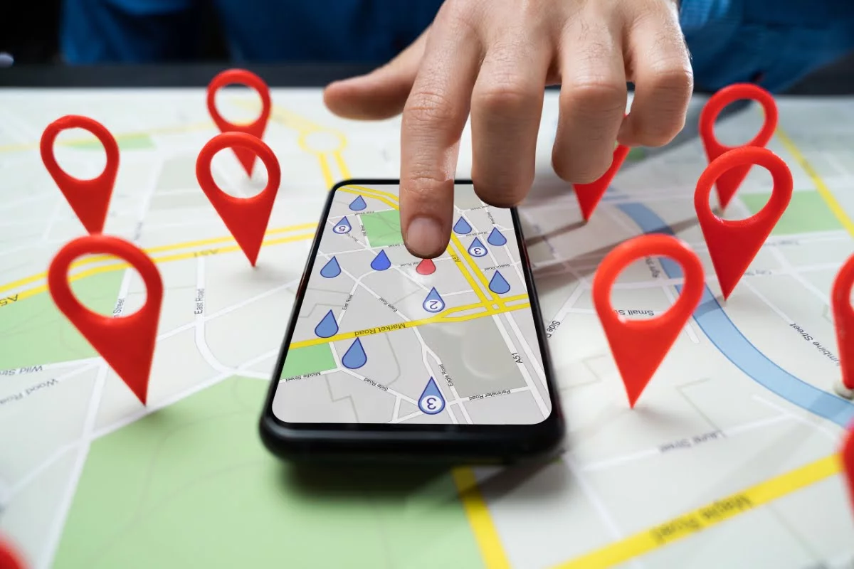 Person using a phone to find a local business on Google Maps