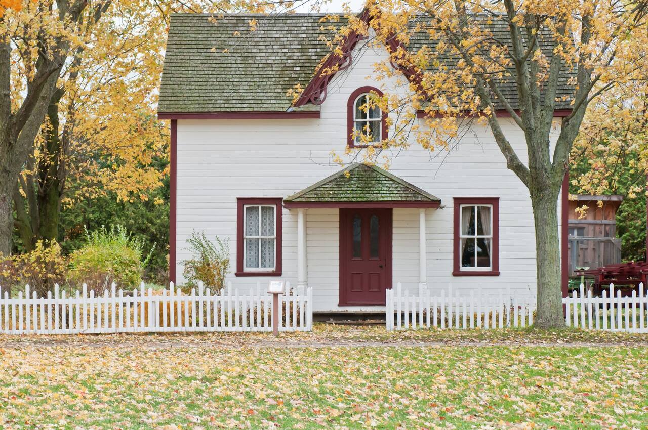 Charming local small business storefront with white picket fence