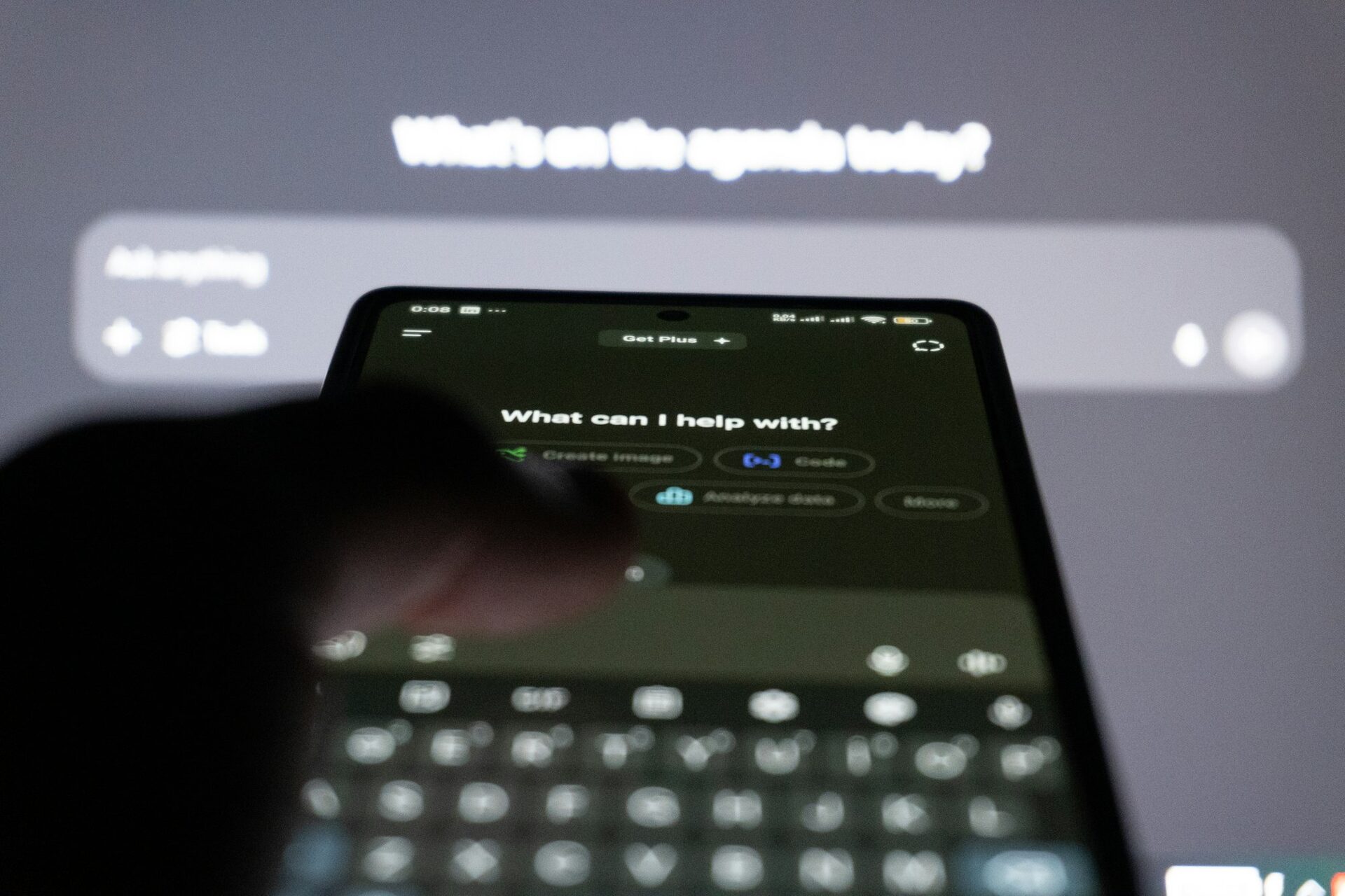 Person using an AI chatbot on a smartphone — showing how customers now rely on AI search tools, answer engines, and conversational platforms to research small businesses