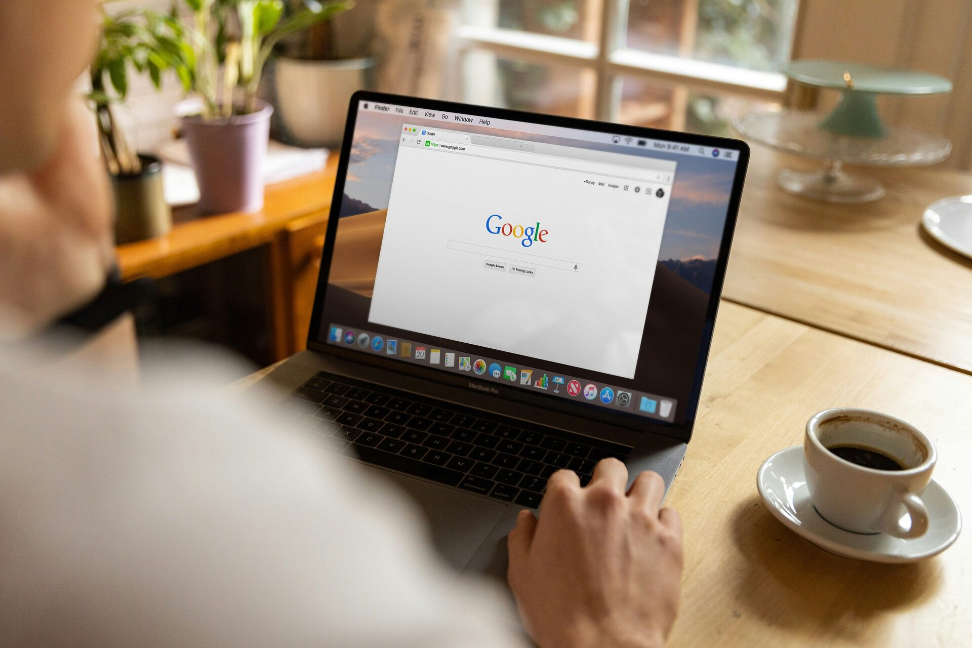 NZ small business owner using a laptop to manage their Google Business Profile — local SEO and Google search visibility support for New Zealand businesses