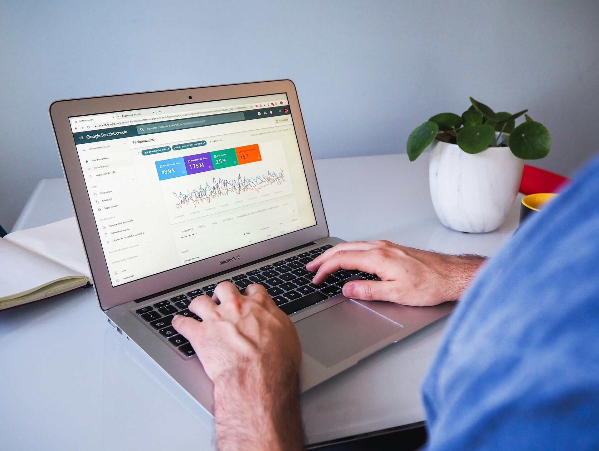 Person using a MacBook Air to review Google Search Console performance data — practical SEO approach for New Zealand small businesses